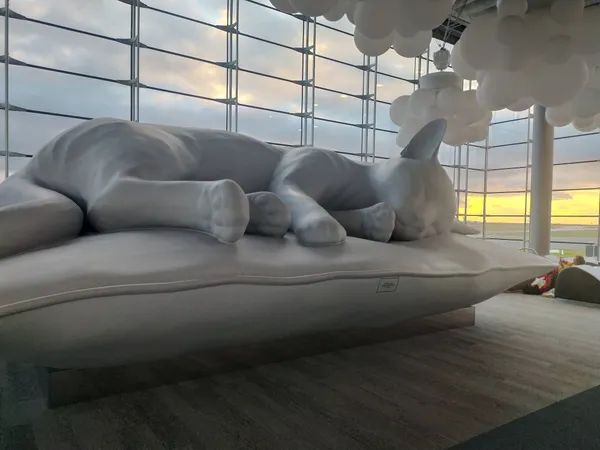 Green tent pitched on a rocky mountain slope